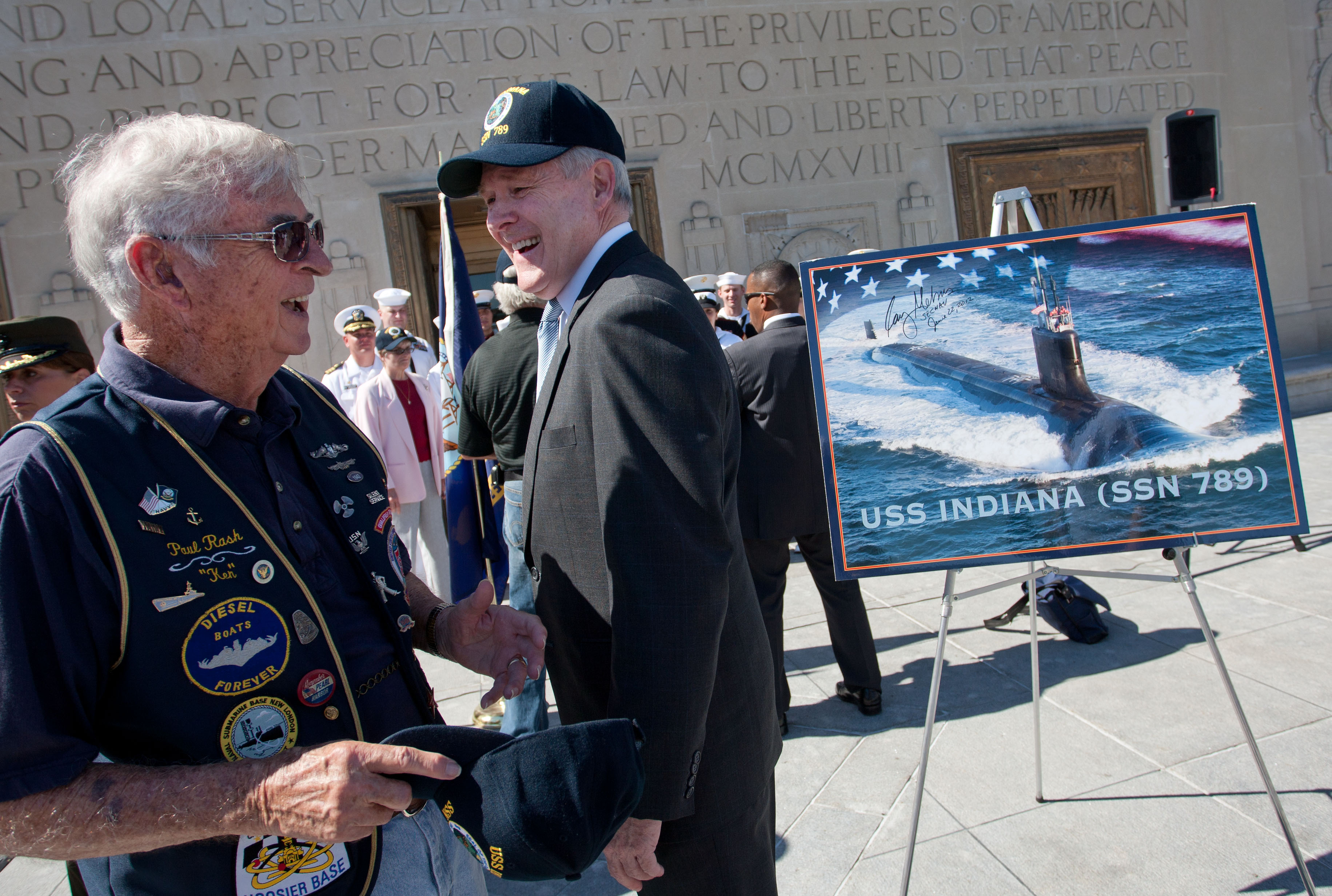 Secretary of the Navy (SECNAV) the Honorable Ray Mabus, right, speaks with WWII submarine veteran Paul Rash, 88, after a ceremony celebrating the naming of the Virginia-class submarine, USS Indiana (SSN 789), at the Indianapolis War Memorial. Rash joined the Navy on Dec. 4, 1941 and served aboard USS Plunger (SS 179) and USS Barbero (SS 317).